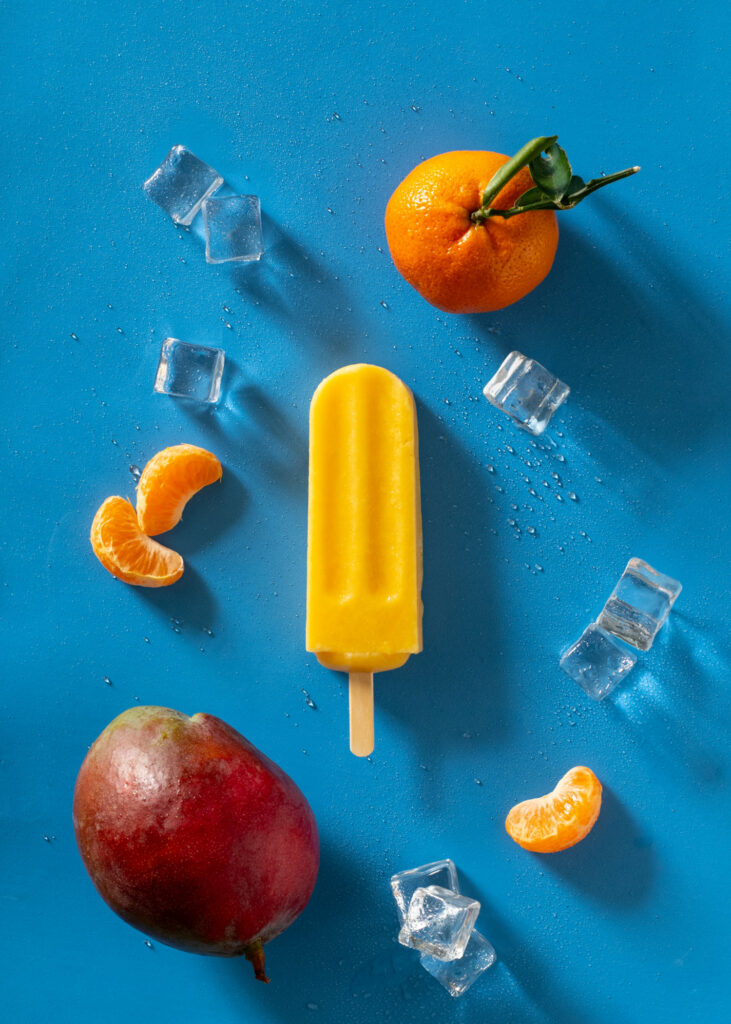 Orange mango ice pop with fresh mango and clementines